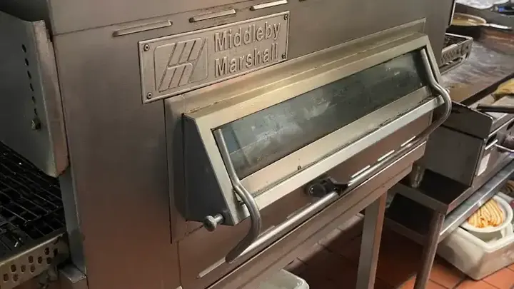 Commercial oven with service panel open